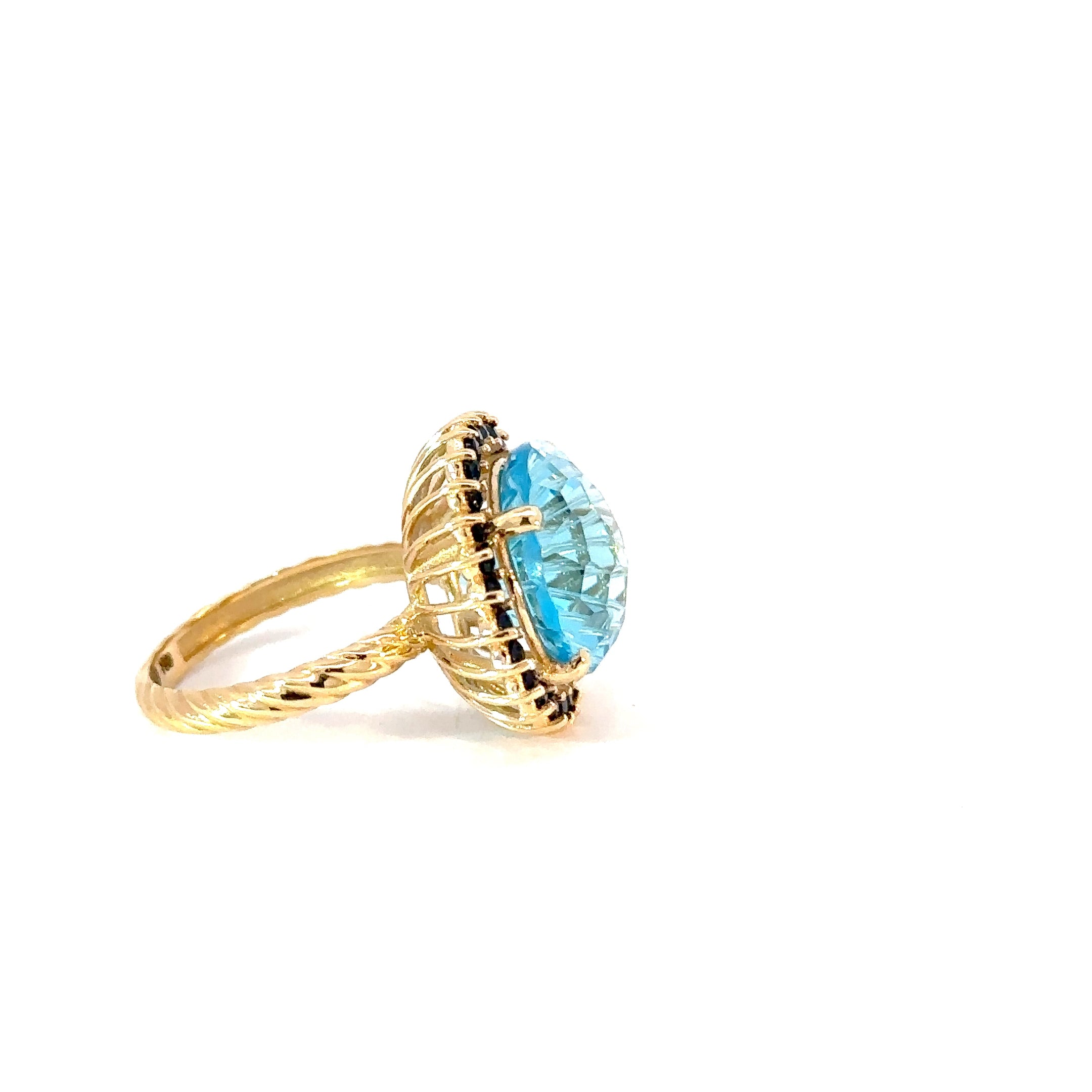 Anillo Flora topacio swiss blue y zafiros azules