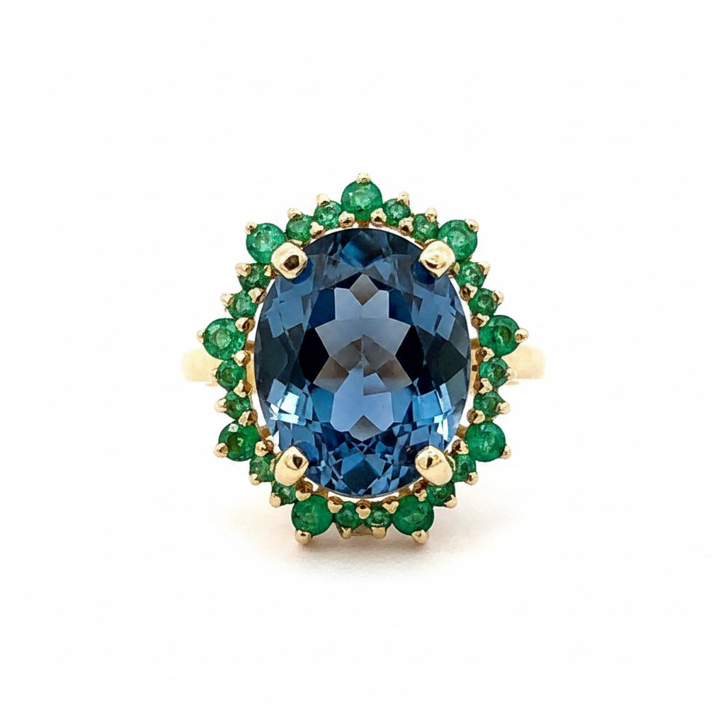 Anillo Aurora topacio london blue y esmeraldas