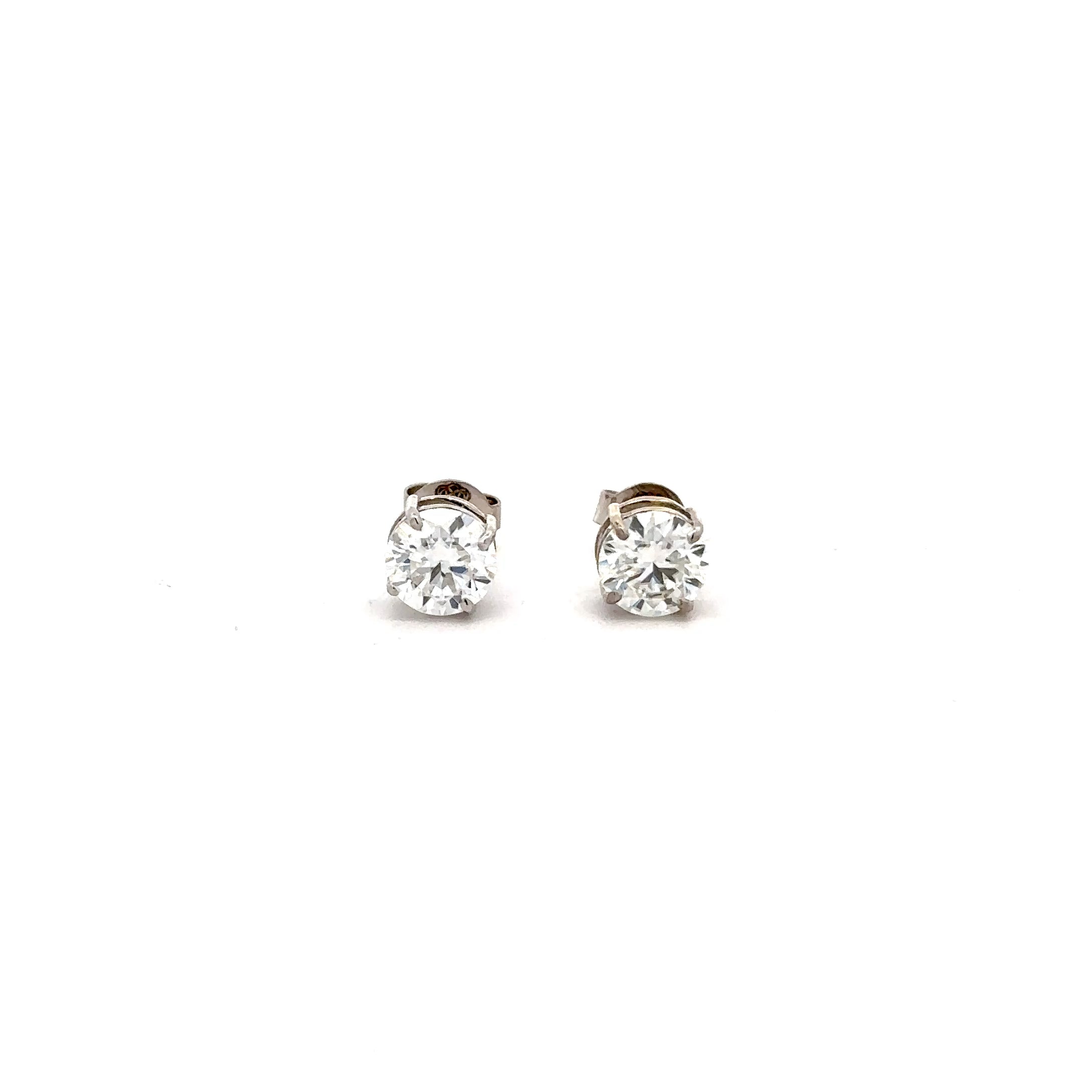 Aretes Moissanita 6.5 mm Oro blanco
