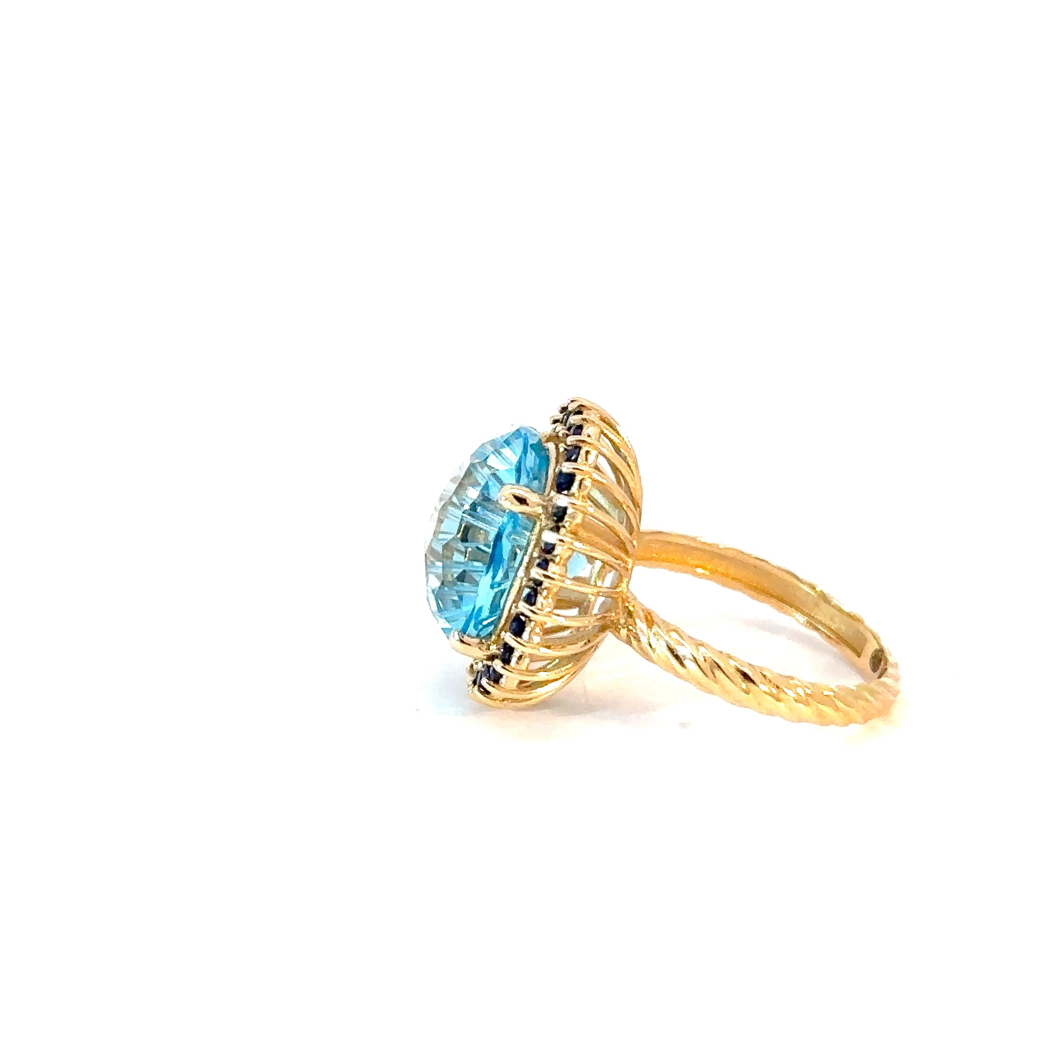 Anillo Flora topacio swiss blue y zafiros azules